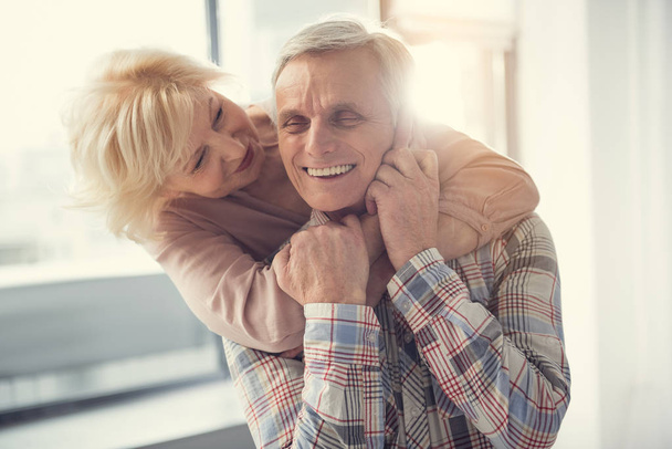 Senior woman showing love to old man - Foto, imagen