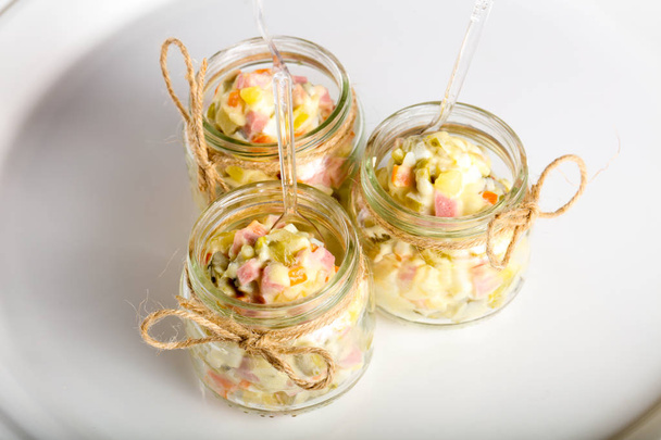 Russian salad served in the glass can - Photo, Image