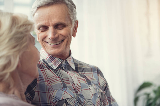 Smiling old man looking at his wife - Valokuva, kuva