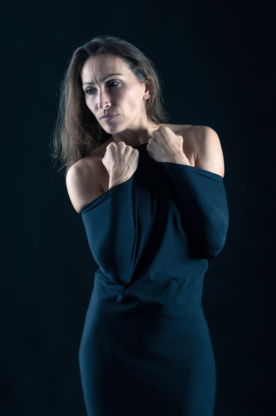 Elegant middle age woman intimate portrait on black background - Zdjęcie, obraz