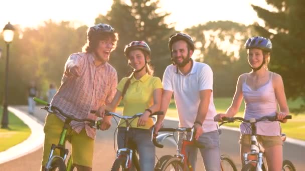Cheerful group of young people with bicycles. - Footage, Video