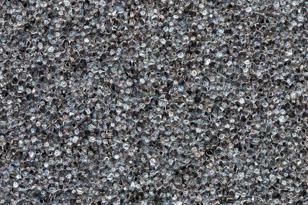 Close-up textura de espuma de poliuretano preto. Infláveis de filme arco-íris. Abstrato fundo celular preto
 - Foto, Imagem