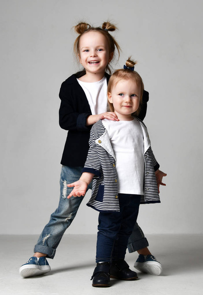 Beautiful little sisters standing together happy smiling - Fotoğraf, Görsel