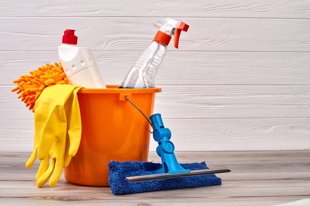 Cleaning supplies in colorful bucket. - Photo, Image