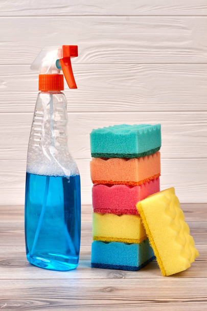 Cleaning sponges and plastic bottle of spray. - Φωτογραφία, εικόνα