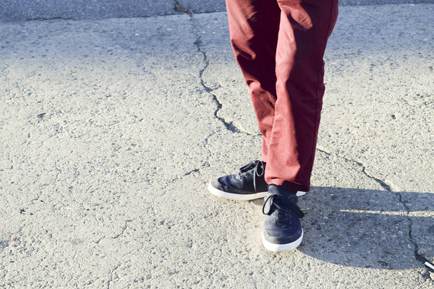 Stylish man with shoes and red pants in the street - Photo, image