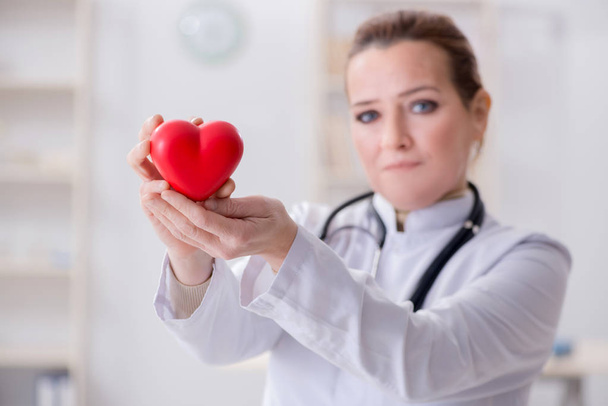 Cardiologist with red heart in medical concept - Photo, Image