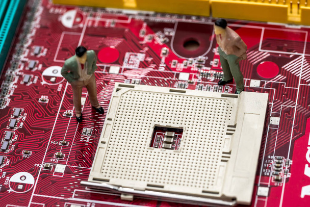 Two businessmen inspect the motherboard . close up - Photo, Image