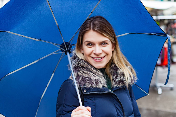 Woman with blue umbrella - Fotoğraf, Görsel