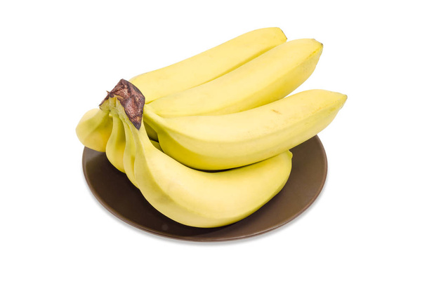 茶色の料理のクローズ アップのバナナのクラスター   - 写真・画像