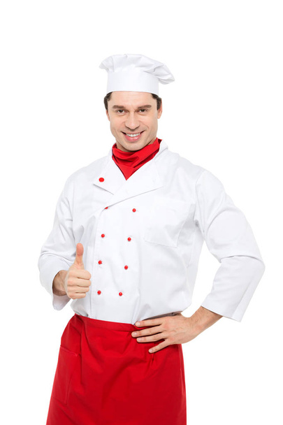 Smiling master chef showing thumb up standing isolated. - Fotó, kép