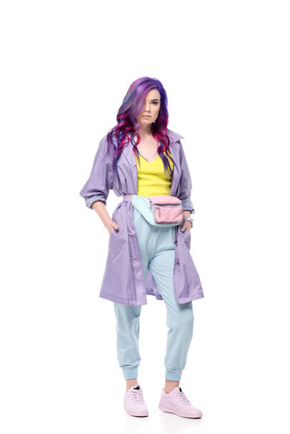 beautiful young woman in purple trench coat with waist pack isolated on white - Foto, Bild