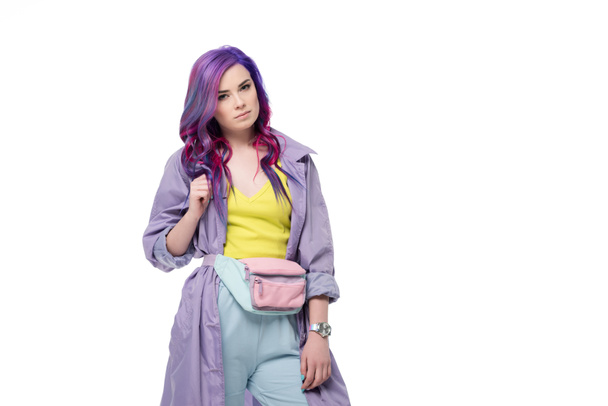 Attractive young woman with purple hair in trench coat with waist pack isolated on white - Φωτογραφία, εικόνα