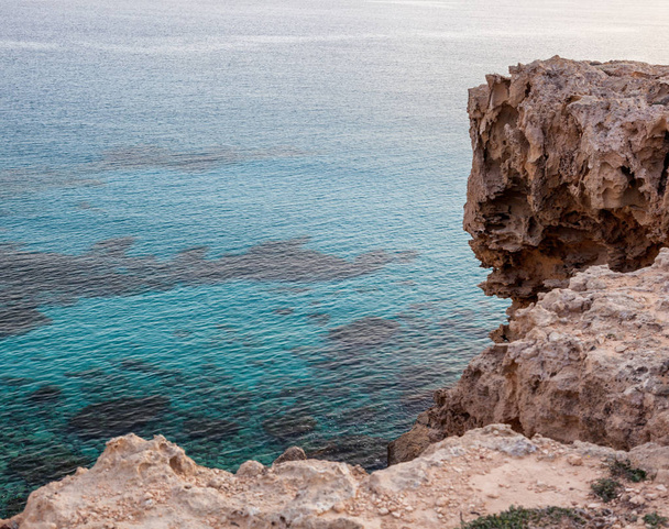 Rocks and azure blue water, Cape Greco, Cyprus - Fotoğraf, Görsel