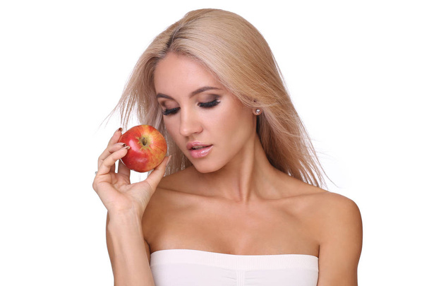 blond woman eat red apple - Фото, зображення