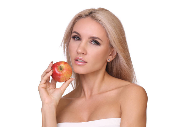 blond woman eat red apple - Foto, imagen