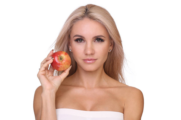 blond woman eat red apple - Fotó, kép