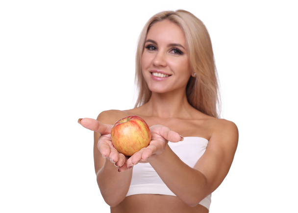 blond woman eat red apple - Zdjęcie, obraz