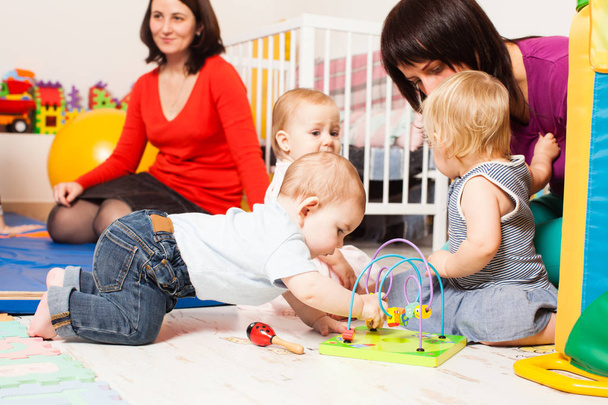Group babies in playroom - Foto, imagen