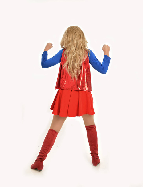 full length portrait of pretty girl wearing super hero costume, standing pose, isolated on white studio background. - Foto, immagini