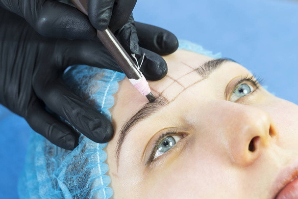 Microblading eyebrows workflow in a beauty salon - Photo, image
