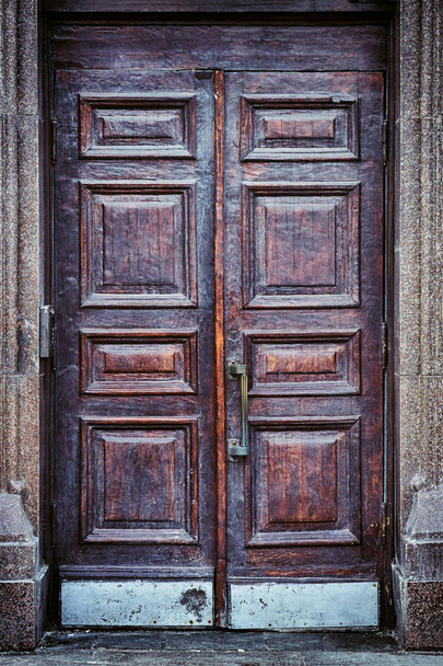 Old wooden door of a Moscow building - 写真・画像