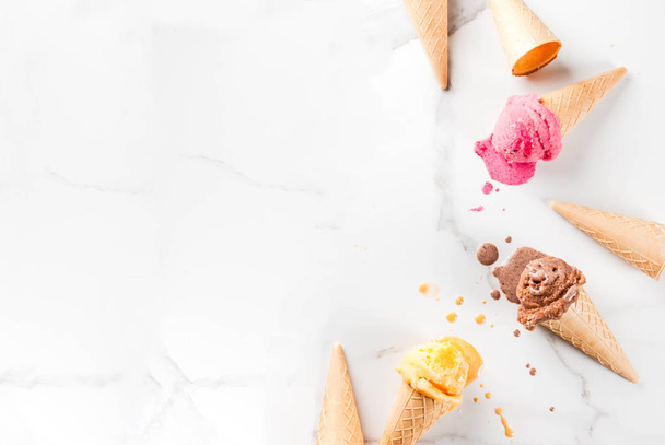Homemade chocolate, vanilla, berry ice cream in ice cream cones, - Fotó, kép