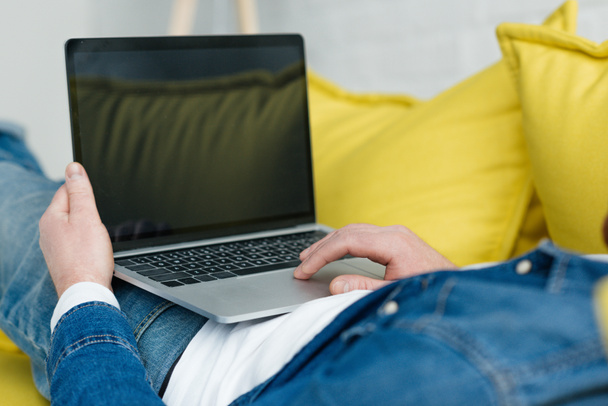 Close-up view of laptop with empty screen in male hands - Фото, зображення