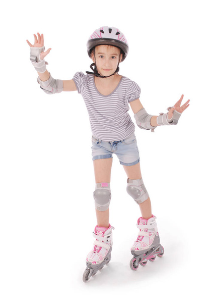 Pequena menina bonita em patins
 - Foto, Imagem
