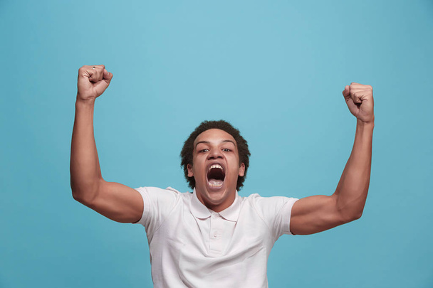 Winning success man happy ecstatic celebrating being a winner. Dynamic energetic image of male model - Photo, image