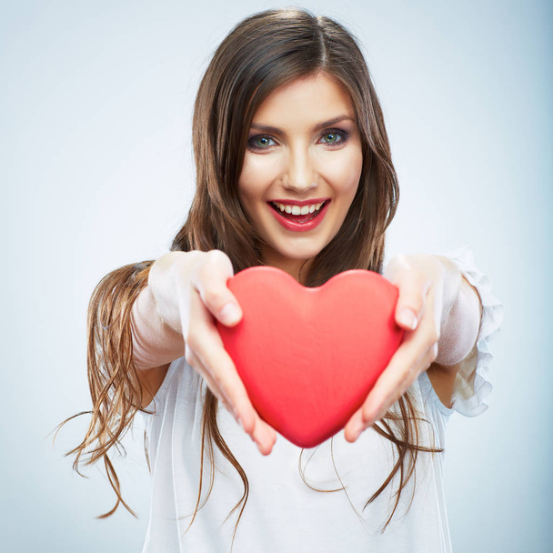 Red heart. Love symbol. Portrait of beautiful woman hold Valent - Φωτογραφία, εικόνα