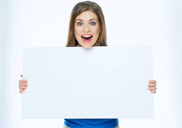 Surprised woman holding advertising board - Foto, Bild