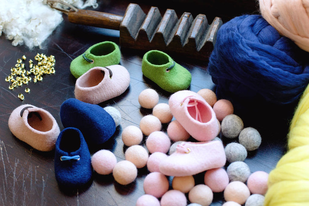 Working conditions for working with merino wool shoes. Creation of children's shoes made of wool. - Photo, Image