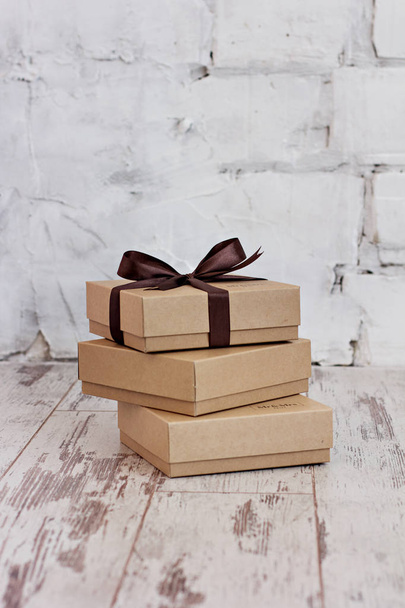 Gift wrapping. Craft gift boxes are stacked. - Photo, Image