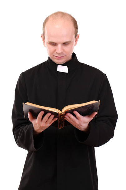 Young pastor with Bible, isolated on white - Fotó, kép