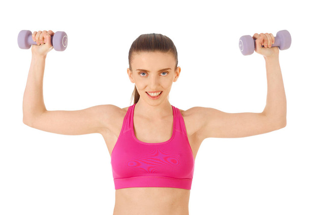 Young woman with hand weights - Foto, Bild
