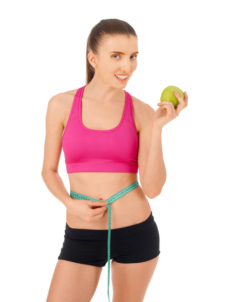 Woman with tape measure and apple - Photo, image
