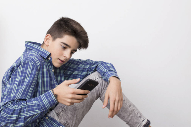 child, teenager or preteen with mobile phone - Foto, Bild