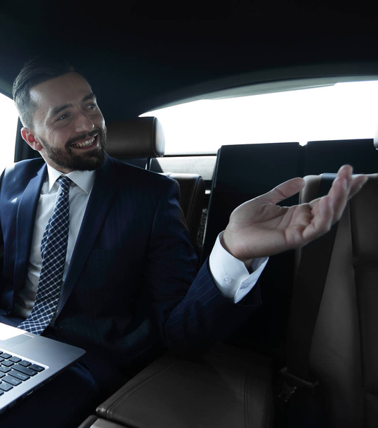 Confident businessman talking in car - Photo, Image