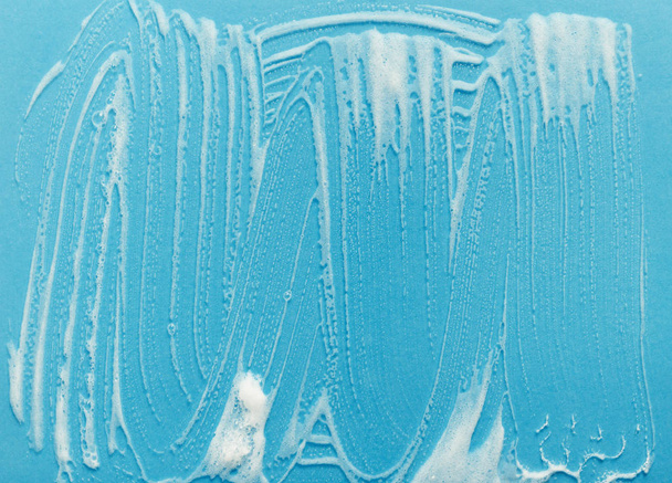 Detergent foam on glass background - Photo, Image