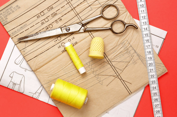 tape measure, pattern, and yellow string for sewing on fabric - Photo, Image
