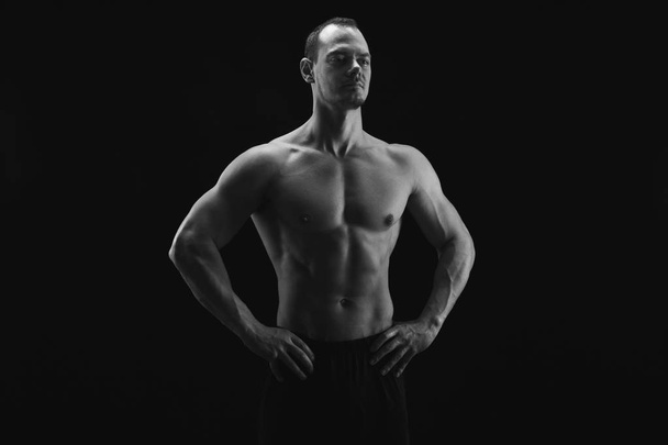 Strong athletic man showes naked muscular body - Photo, image