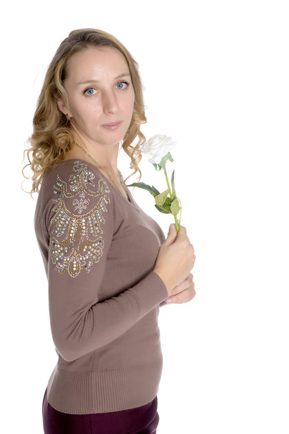 Young woman with a flower in her hands - Foto, Bild