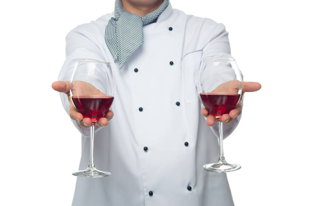 cook, holds two glasses of red wine - Foto, Imagem
