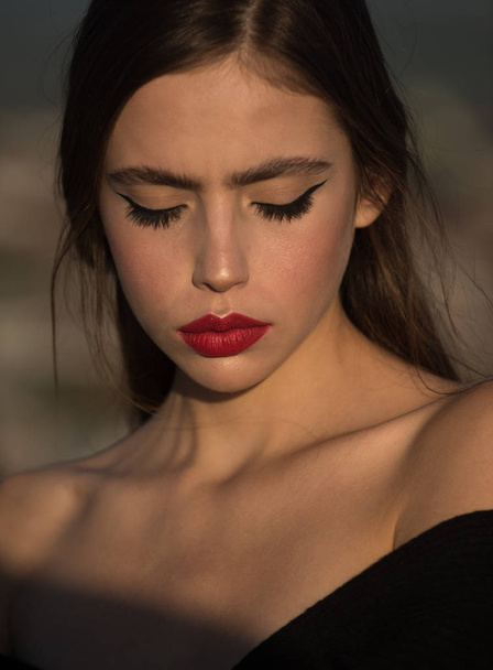 girl with red lips. Hairdresser and skincare, summer fashion. Beauty and fashion, cosmetics. Fashion look of stylish woman in black, makeup. Elegant woman with long hair. - Fotoğraf, Görsel