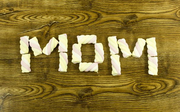 Mothers Day concept.Written with marshmallows on wooden background. - Zdjęcie, obraz