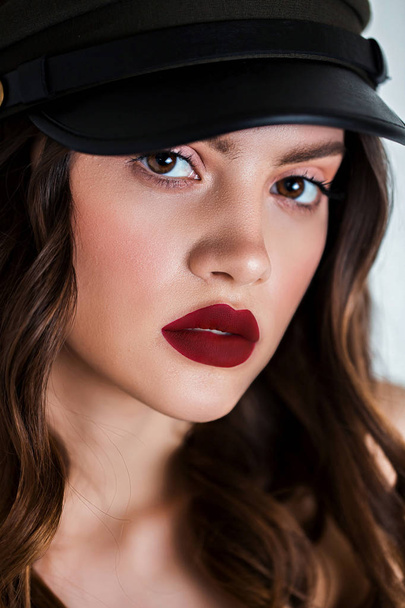 Close up the face of a beautiful woman with professional make up and red lips. Lipstick, lip gloss, cosmetics. - Valokuva, kuva