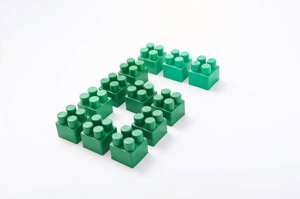 figures from a colored cubes designer on a white background - Foto, Imagem