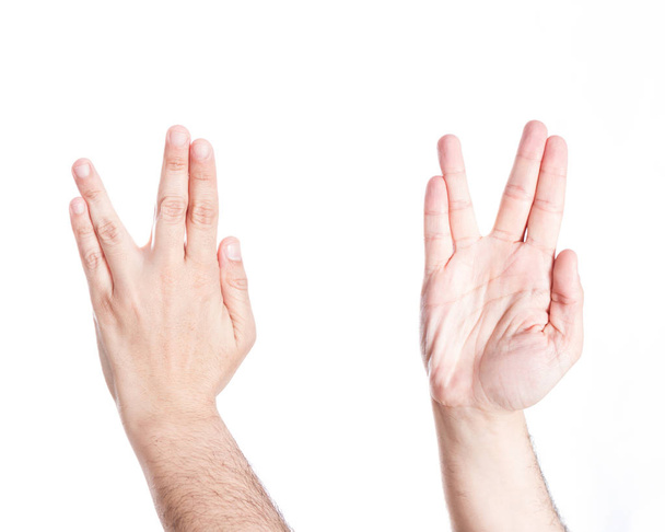 Ręce gestykulacji salute Vulcan, na białym tle. - Zdjęcie, obraz