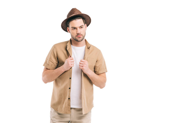 handsome bearded young man in hat and shirt looking away isolated on white - Φωτογραφία, εικόνα